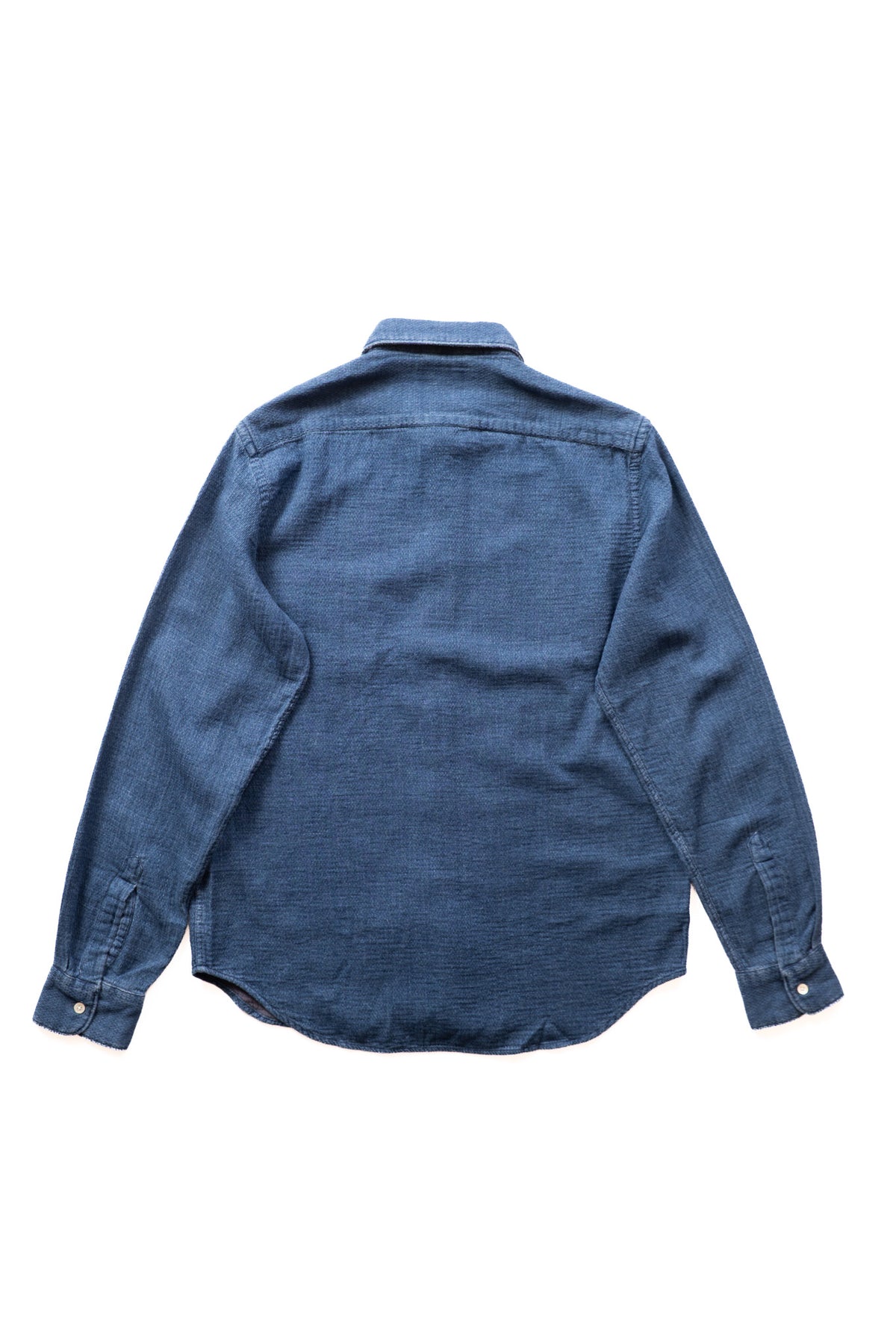 A blue long-sleeve button-up shirt shown from the back, laid flat against a solid white background.