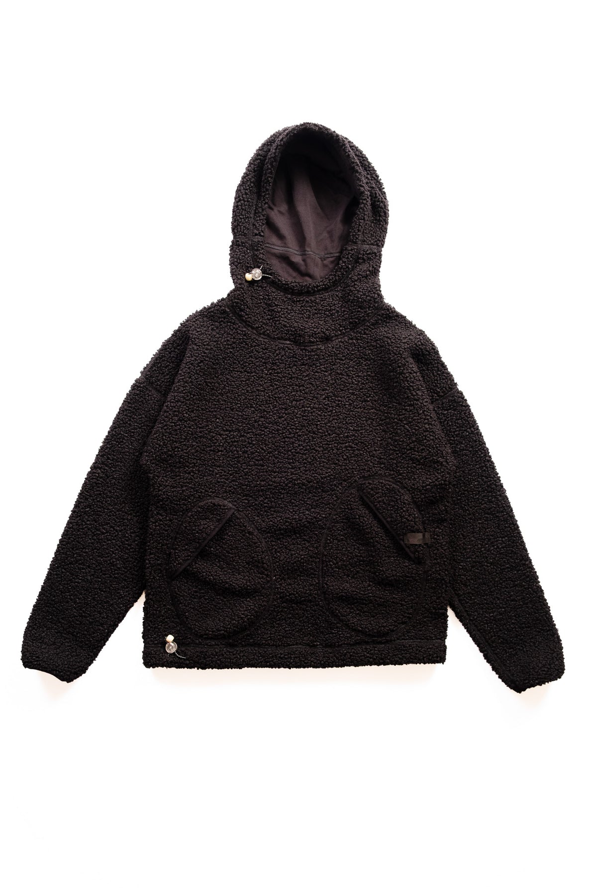 A black sherpa fleece hooded sweatshirt with a high collar, and front pockets, displayed flat against a solid white background.
