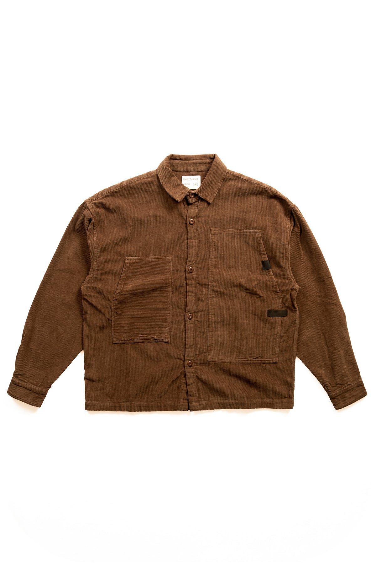 A brown corduroy button-up shirt jacket with a pointed collar, long sleeves, and two front flap pockets, laid flat against a white background.