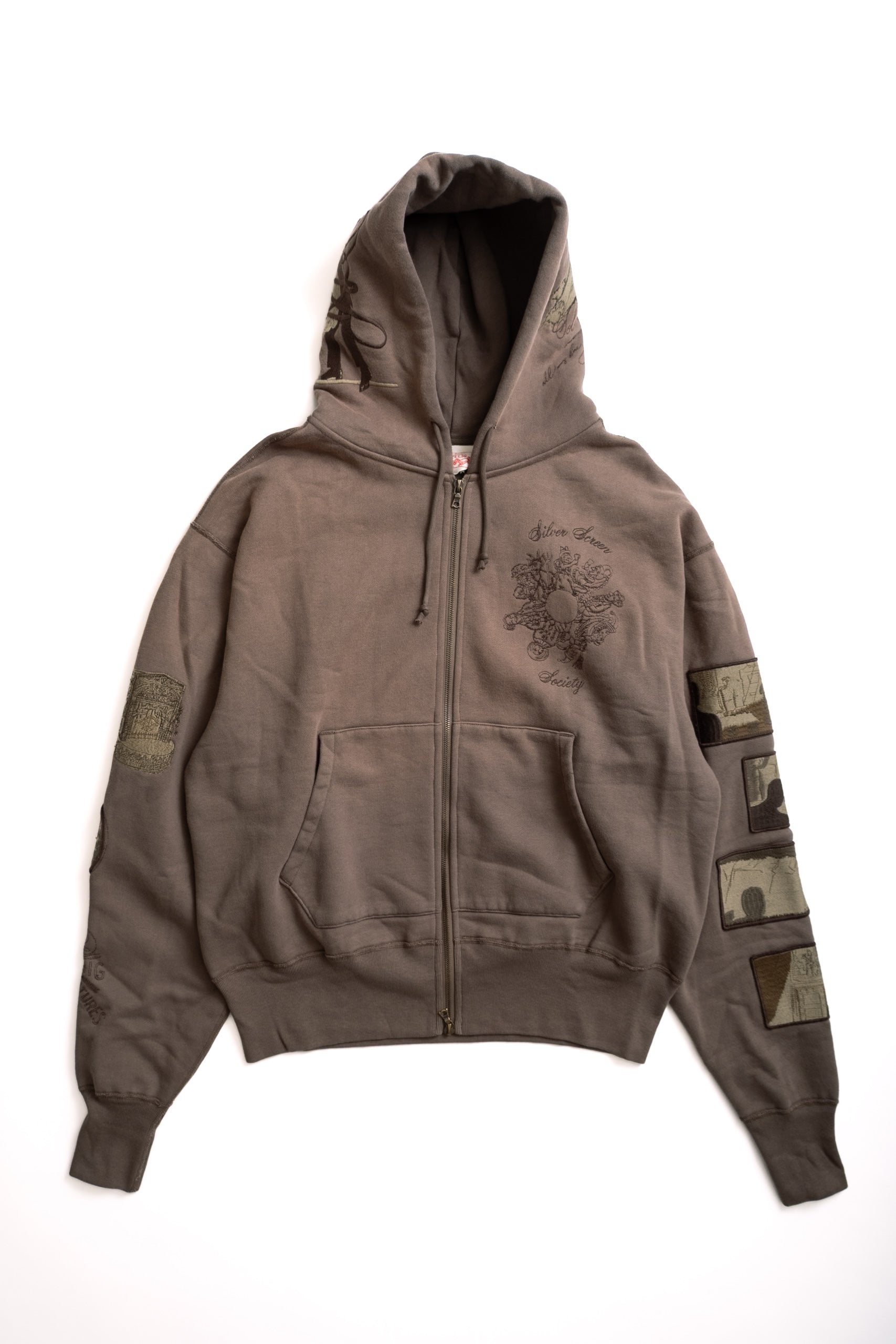 Brown hoodie with patches on a white background