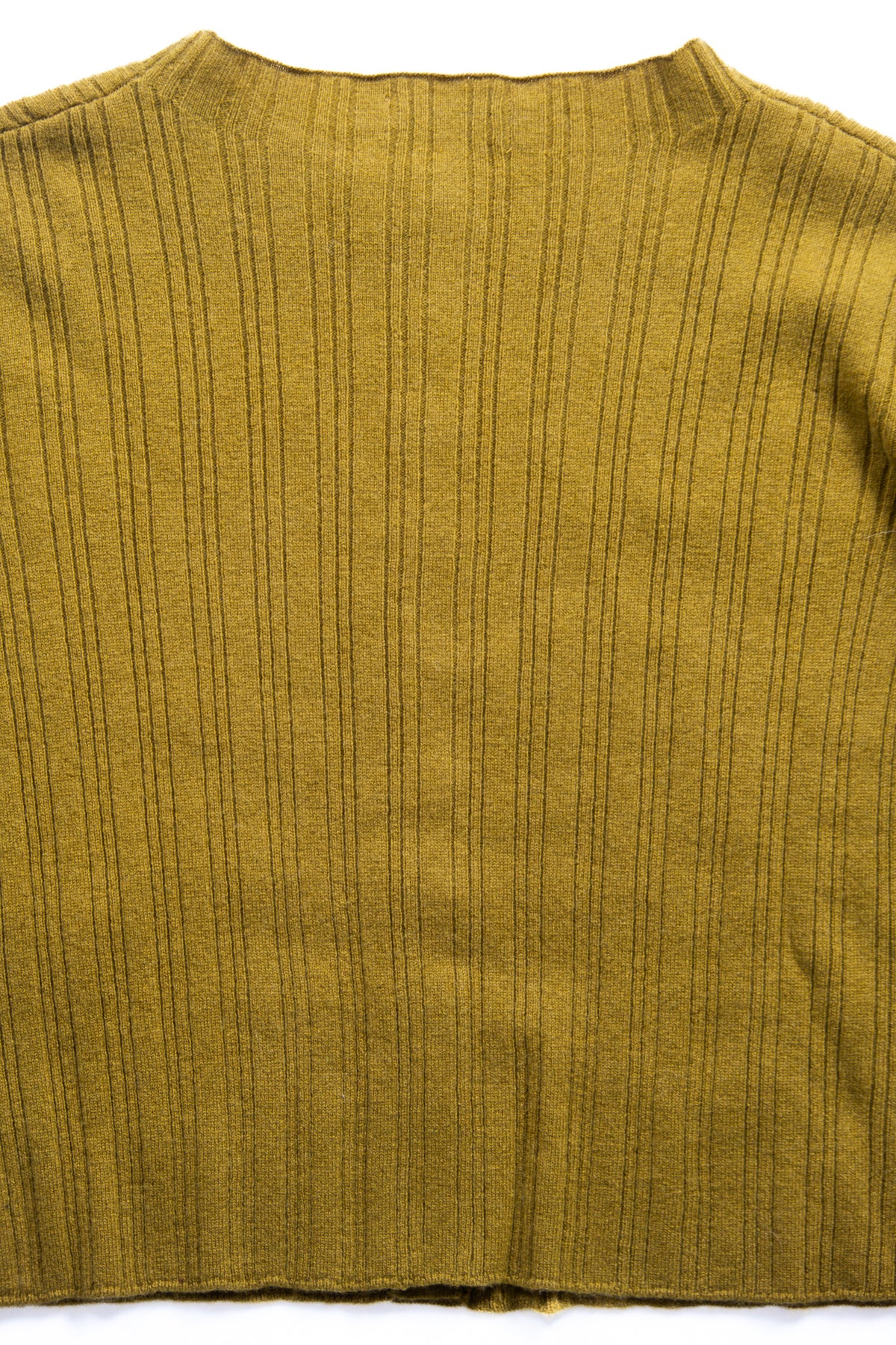 Close-up of the back of a ribbed knit sweater in a yellow green color, showing vertical ribbing and a crew neckline.