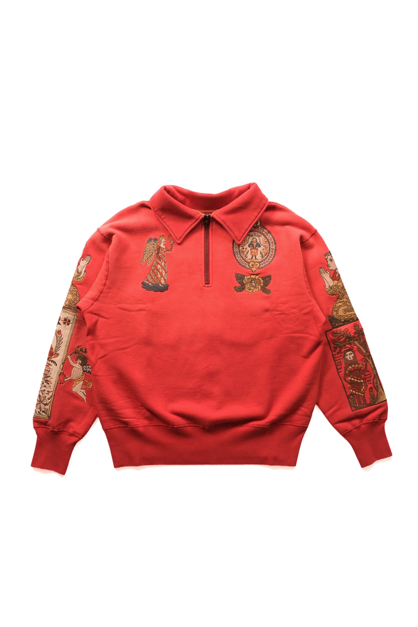 image of a red quarter zip featuring embroidered imagery on the chest and some on the sleeves. presented on a white background