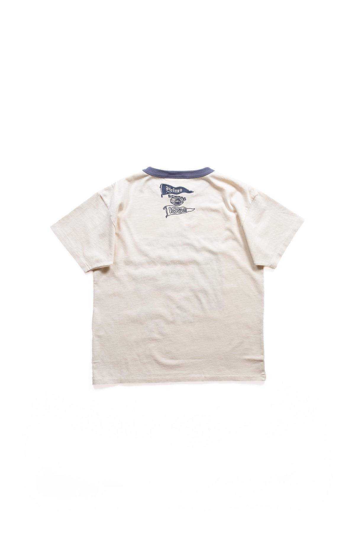 A cream-colored short-sleeve t-shirt shown from the back with a faded blue collar and a small dark blue graphic on the upper back of athletic pennants, shown flat against a white background.