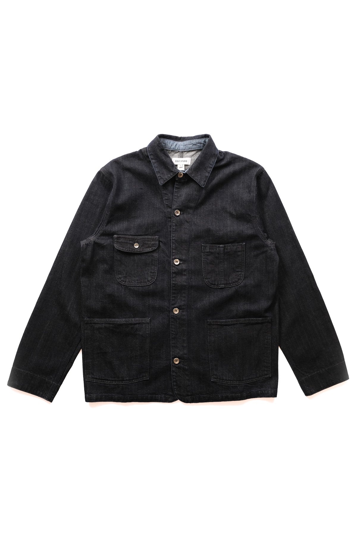 A dark indigo denim jacket with a button-down front, two chest flap pockets, and two large lower patch pockets, laid flat on a white background.
