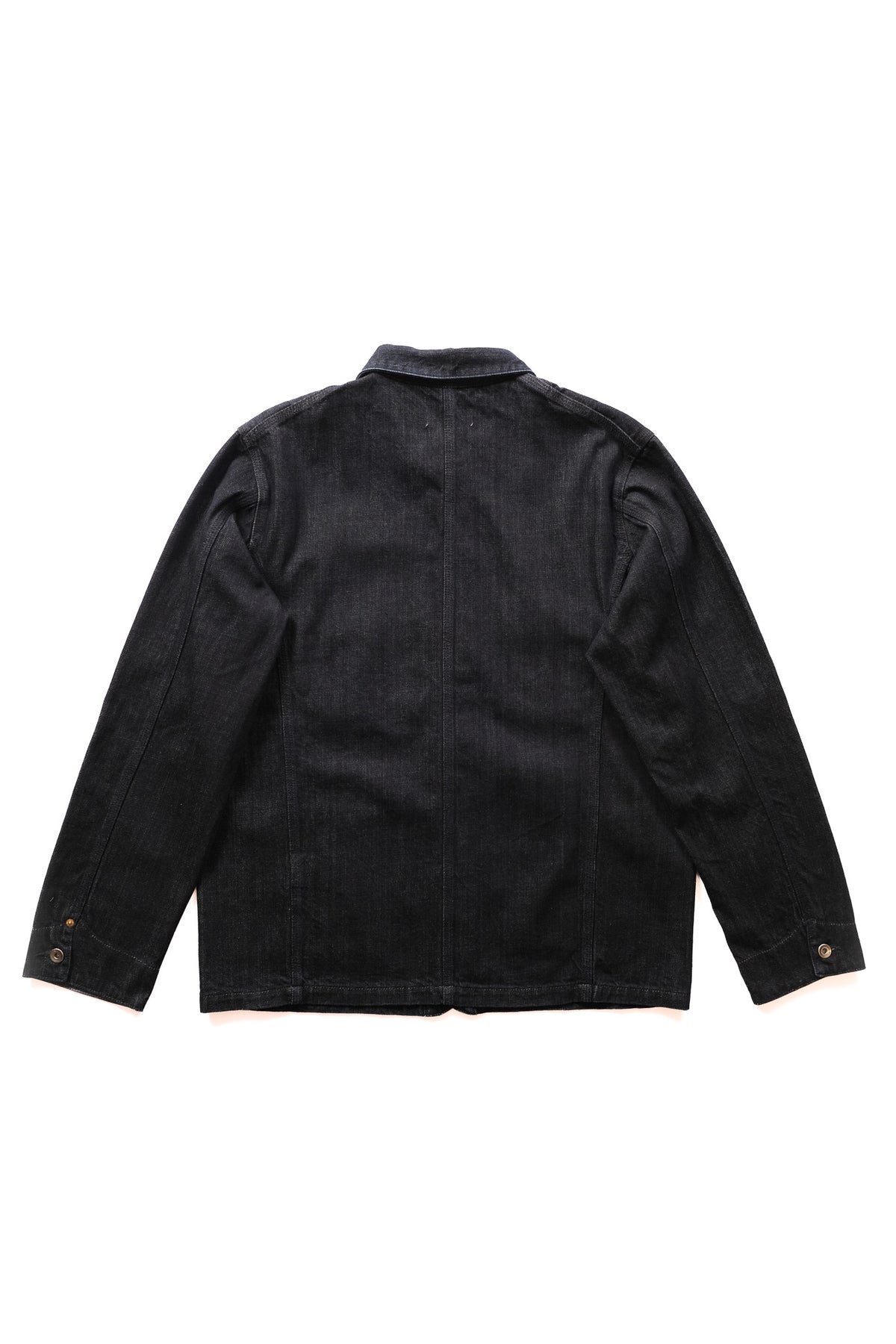 A dark denim jacket shown from the back, laid flat against a solid white background.