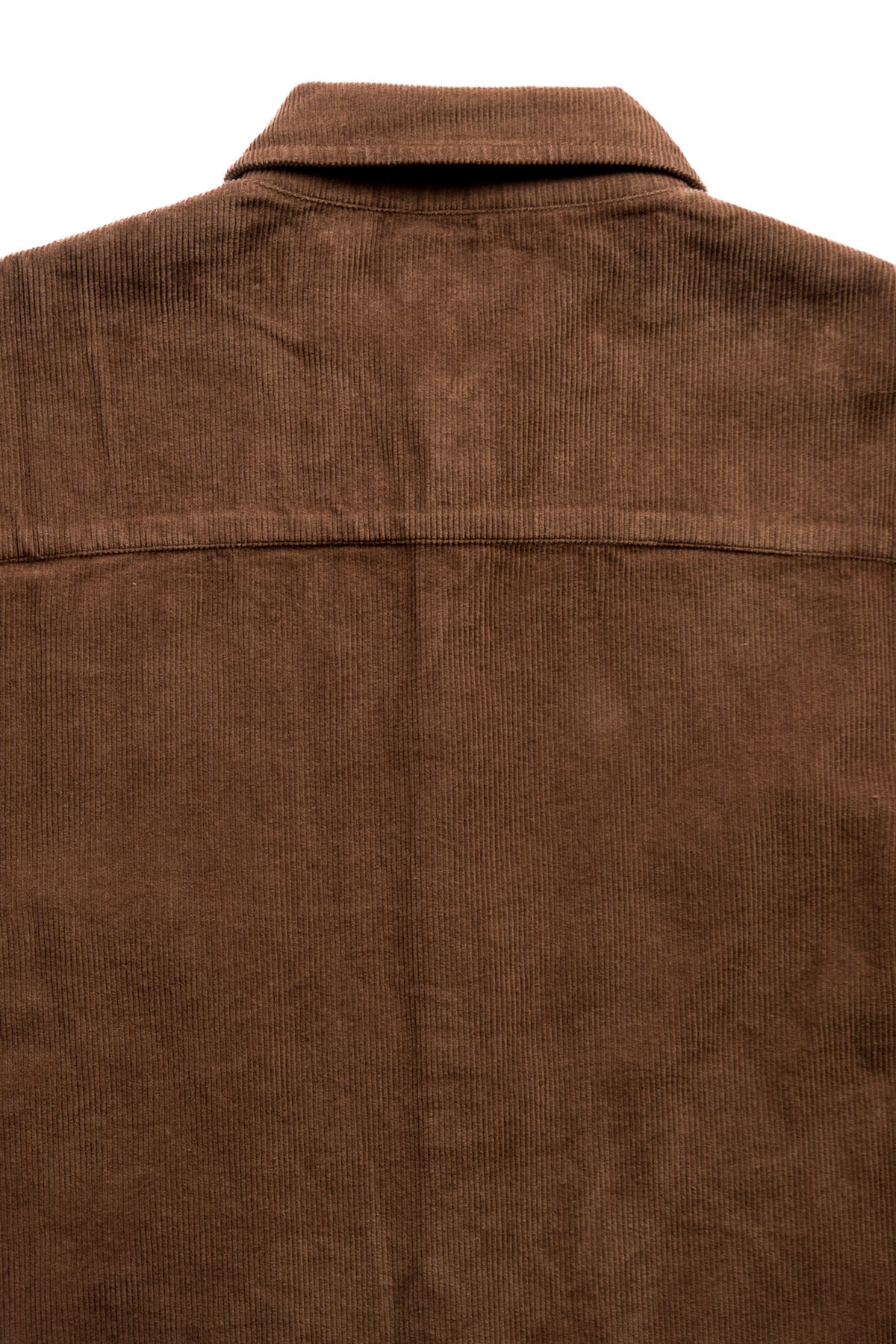 Close-up of the back of a brown corduroy jacket, showing the textured corduroy fabric and collar against a plain white background.