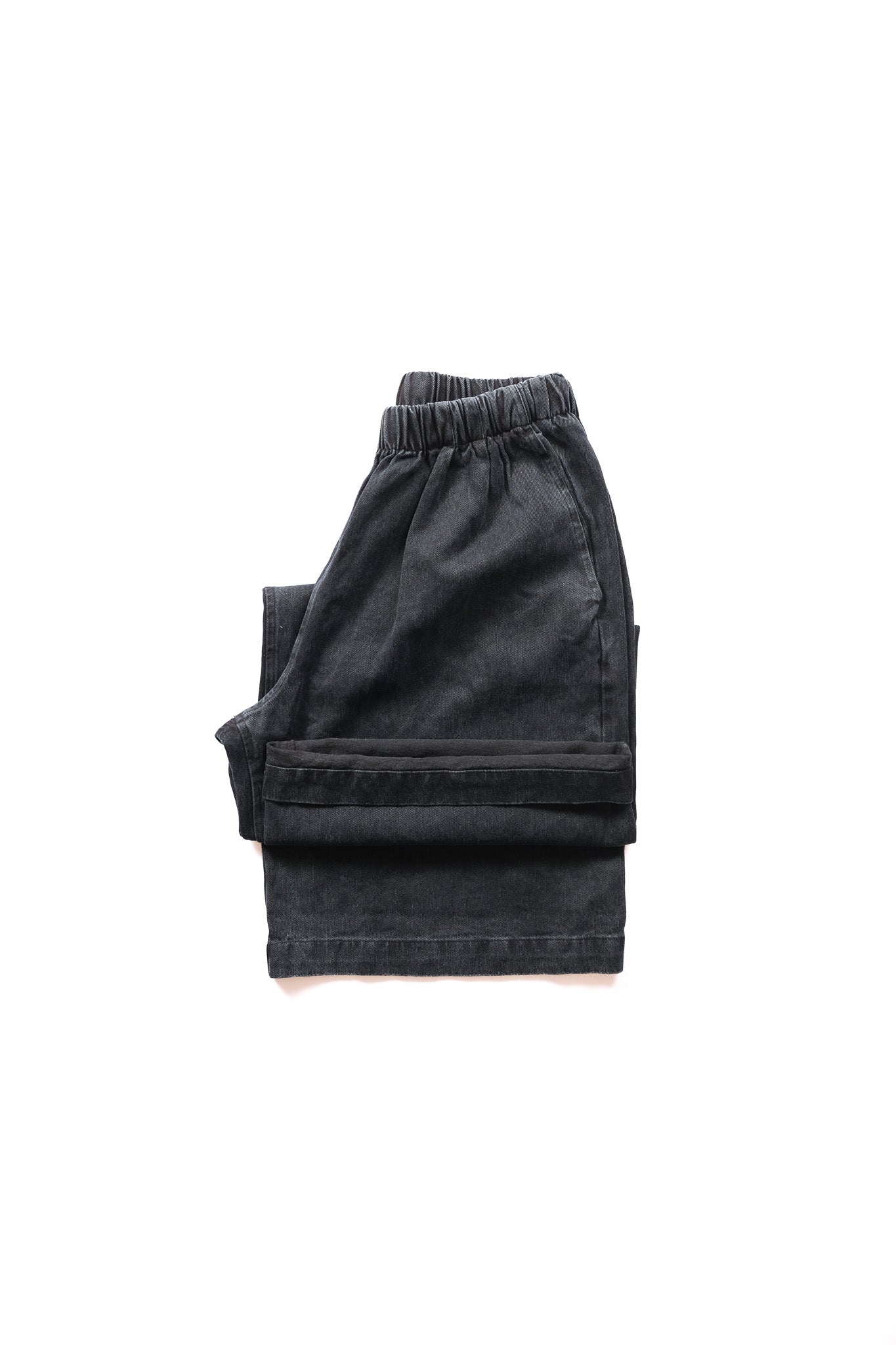 folded pair of elastic wide legged pant presented on a white background