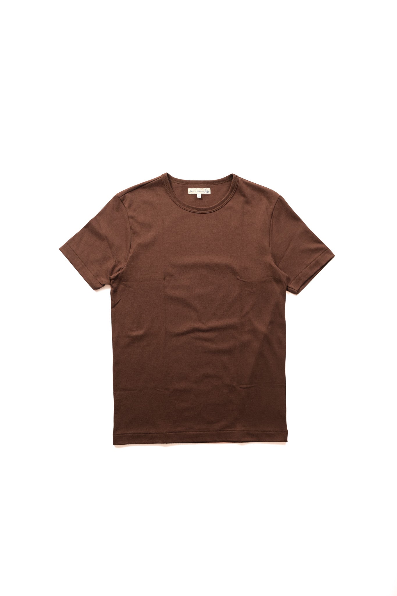 A brown short-sleeve crewneck t-shirt with a single chest pocket, laid flat against a solid white background.