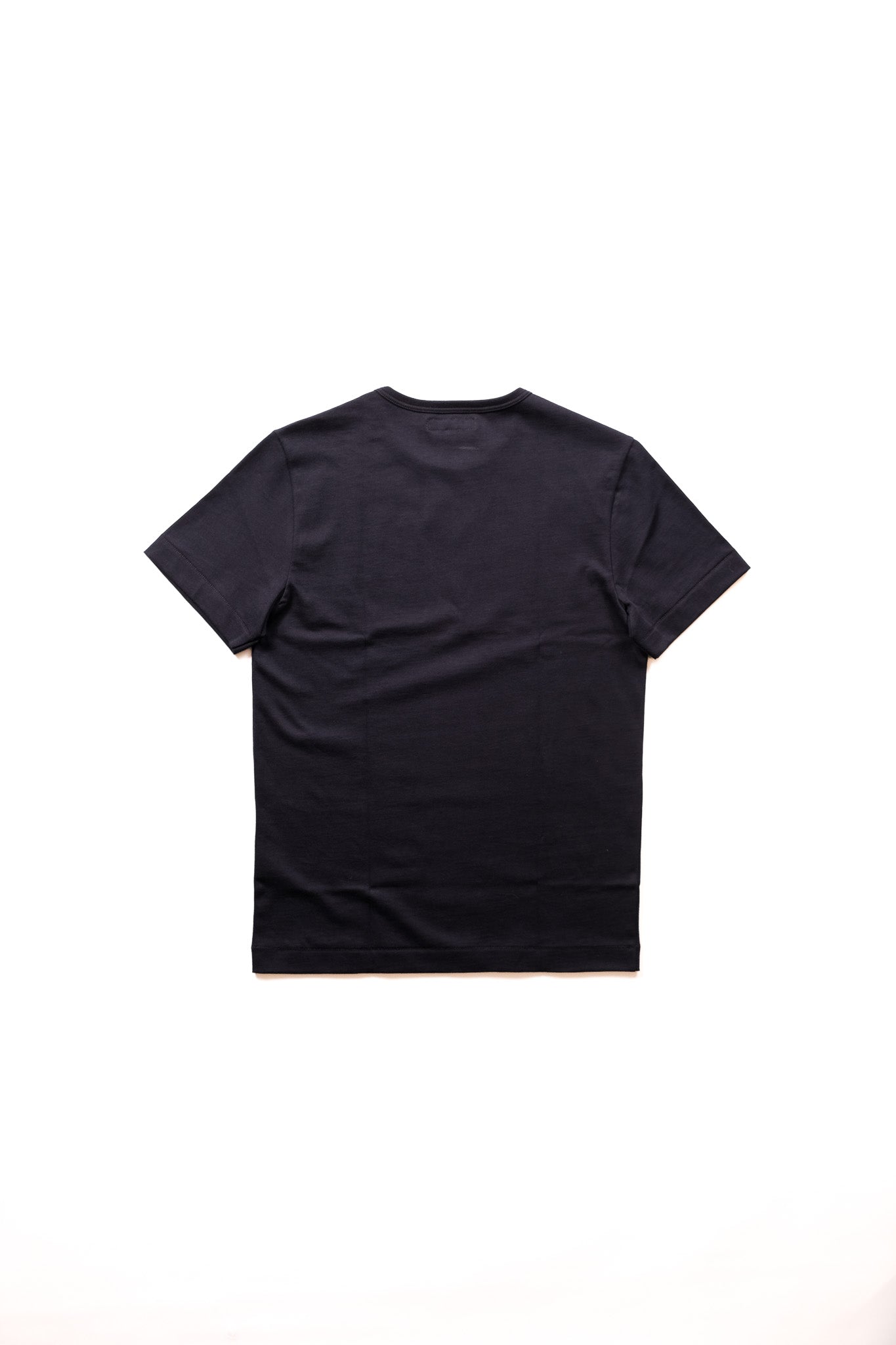 A plain ink blue short-sleeve crewneck t-shirt from the back laid flat against a solid white background.