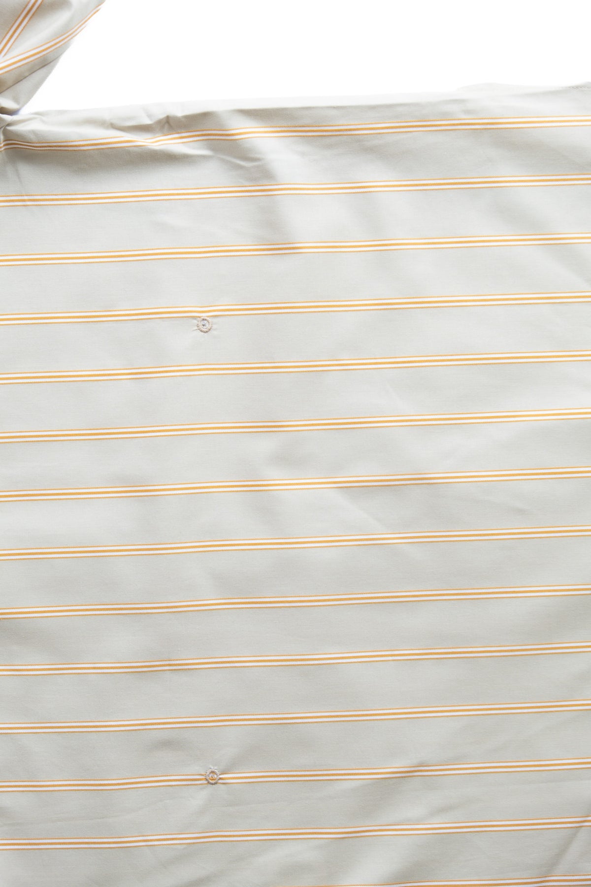 A close-up of a light sage-colored fabric with thin, evenly spaced caramel colored  stripes.